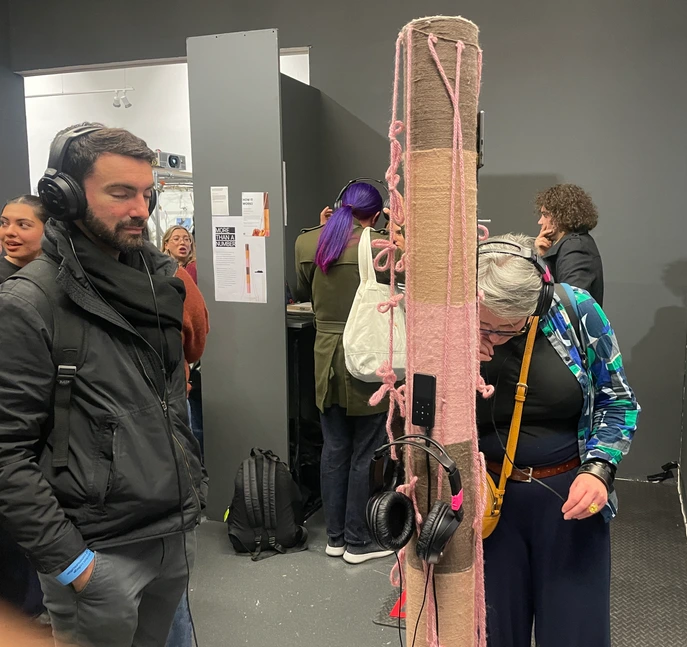 Exhibition — visitors tying knots