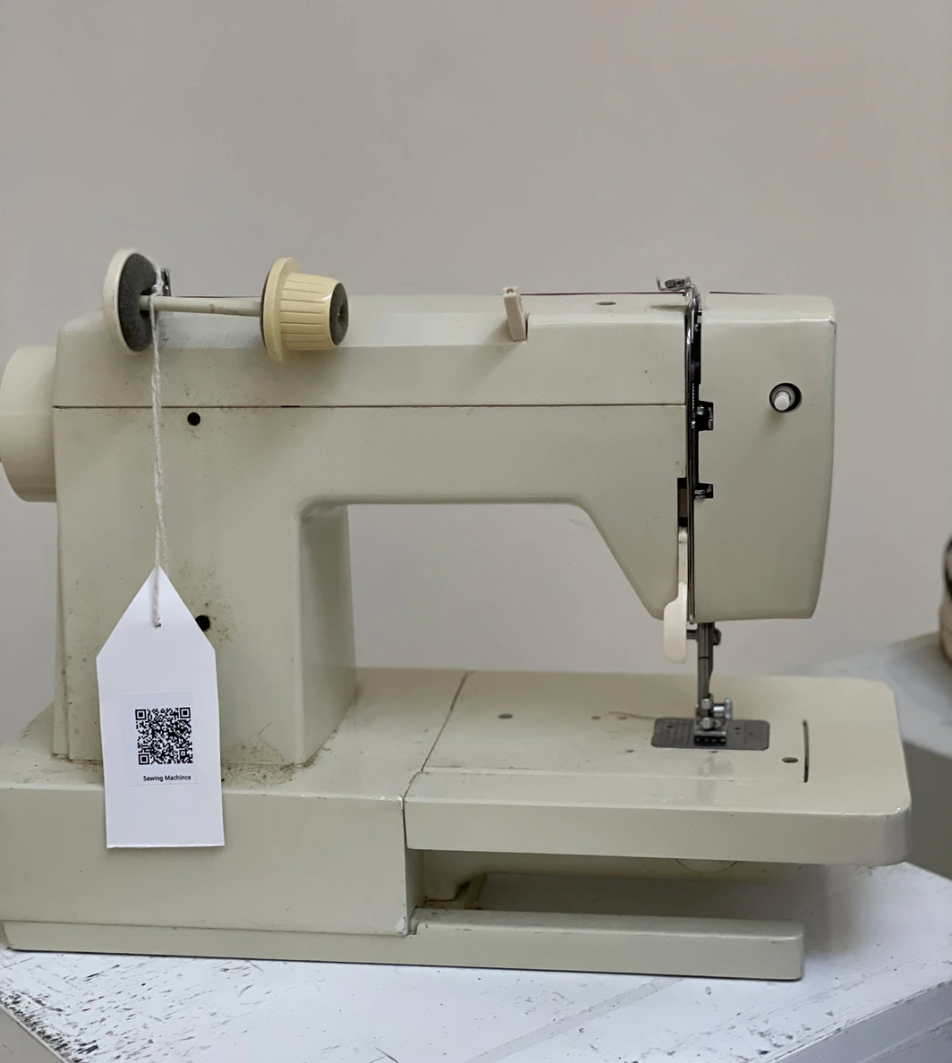 Exhibition — sewing machine with QR price tag